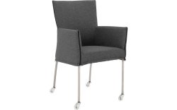 Goossens Eetkamerstoel Funk RVS Poten donkergrijs stof met armleuning en met wielenTransparant skater wiel met rvs kap, modern design