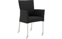 Goossens Eetkamerstoel Funk RVS Poten antraciet stof met armleuning en met wielenTransparant skater wiel met rvs kap, modern design