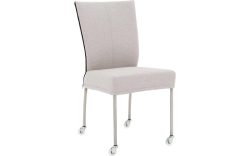 Goossens Eetkamerstoel Funk RVS Poten lichtgrijs stof leuning en met wielenTransparant skater wiel met rvs kap, modern design